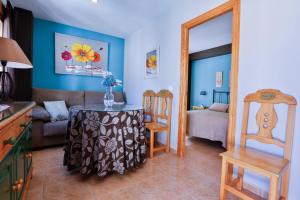 Postel nebo postele na pokoji v ubytování Apartamentos Castillo Cazorla