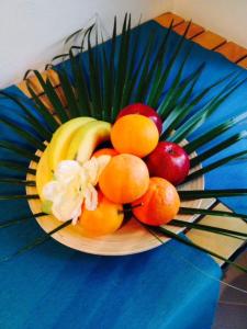 a bowl of fruit on a blue table at Blue B&B in Formia