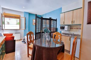 Kuchyň nebo kuchyňský kout v ubytování Apartamentos Castillo Cazorla