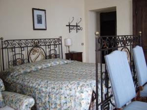Säng eller sängar i ett rum på Santuario di Oropa