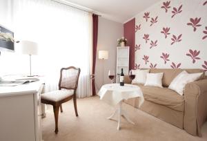 Posezení v ubytování Boutiquehotel Das Haus am Walde