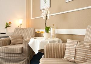 Posezení v ubytování Boutiquehotel Das Haus am Walde