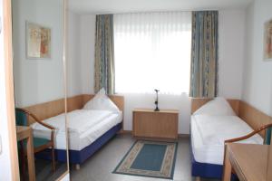 Postel nebo postele na pokoji v ubytování RIESENjunior Hanau by Trip Inn
