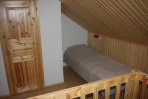 Postel nebo postele na pokoji v ubytování Lost Inn Cabins
