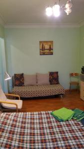a living room with a couch and a rug at Shievchienko 10 in Kyiv