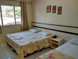 Ένα ή περισσότερα κρεβάτια σε δωμάτιο στο Sayuri hotel