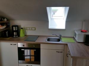 Kuchyň nebo kuchyňský kout v ubytování Ferienwohnung Hein
