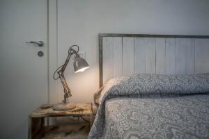 Cama o camas de una habitación en Locazione Turistica Duca d'Aosta 31