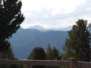 a view of the mountains from the porch of a house at Haus Hubert in Arzl im Pitztal
