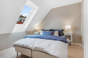 מיטה או מיטות בחדר ב-Fosswinckel Apartments