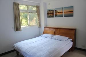 Postel nebo postele na pokoji v ubytování Shan Hu Lian Homestay