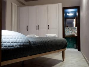 A bed or beds in a room at Casa vacanze Scurò - Isnello