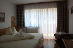 Łóżko lub łóżka w pokoju w obiekcie Landhotel Wolf