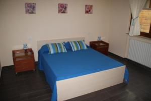 A bed or beds in a room at Un Posto Al Sole