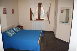 A bed or beds in a room at Un Posto Al Sole