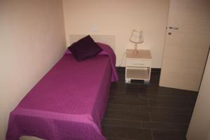 A bed or beds in a room at Un Posto Al Sole
