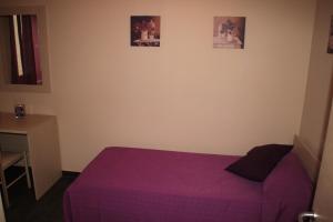 A bed or beds in a room at Un Posto Al Sole