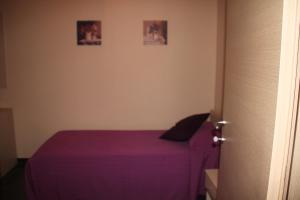 A bed or beds in a room at Un Posto Al Sole