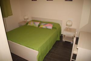 A bed or beds in a room at Un Posto Al Sole