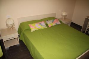 A bed or beds in a room at Un Posto Al Sole