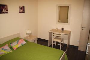 A bed or beds in a room at Un Posto Al Sole