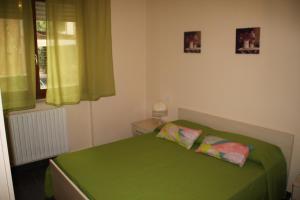 A bed or beds in a room at Un Posto Al Sole