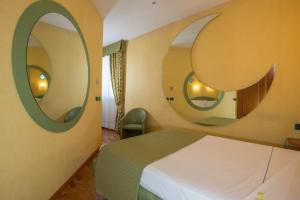 Postel nebo postele na pokoji v ubytování SIRIOHotel