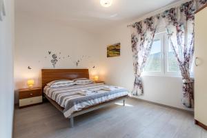 Posteľ alebo postele v izbe v ubytovaní House Luce with pool + 37 fotografií