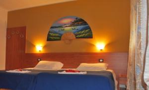 Postel nebo postele na pokoji v ubytování Laguna B&B