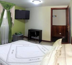Voodi või voodid majutusasutuse Apartahotel Vincent Suites toas