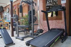 a gym with two tread machines and a treadmill at Argo Hotel in Lazarevskoye