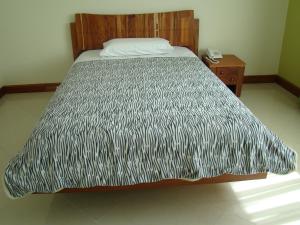 Voodi või voodid majutusasutuse Apartahotel Vincent Suites toas