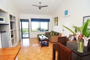 a living room with a couch and a table at Pacific Lagoon Apartments in Port Vila