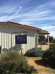 a building with a sign for a margarita mixer at Black Jack Get-A-Way "Magpies Nest" in Orroroo