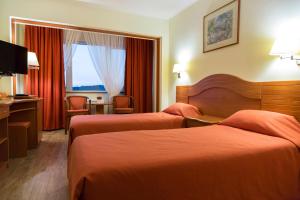 Postel nebo postele na pokoji v ubytování Hotel Germisara