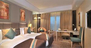 Postel nebo postele na pokoji v ubytování Radisson Hyderabad Hitec City