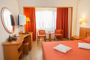 Postel nebo postele na pokoji v ubytování Hotel Germisara