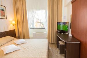 Postel nebo postele na pokoji v ubytování Hotel Germisara
