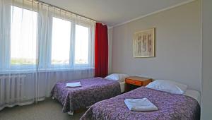 Postel nebo postele na pokoji v ubytování Hotel Felix