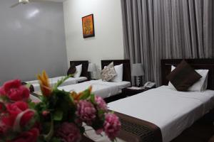 Letto o letti in una camera di Majan Guest House L.L.C.