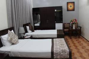 Letto o letti in una camera di Majan Guest House L.L.C.
