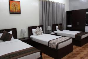 Letto o letti in una camera di Majan Guest House L.L.C.