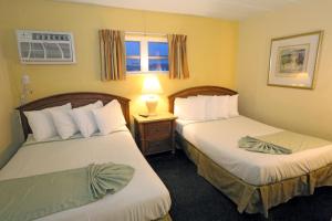 Postel nebo postele na pokoji v ubytování Quebec Motel + 17 fotografií