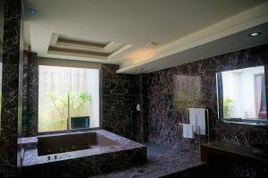 Koupelna v ubytování Her Home Spa Motel Xinying