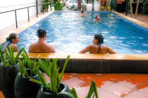 a group of people in a swimming pool at Tropical Breeze in Siem Reap