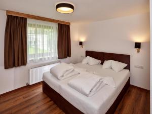 A bed or beds in a room at A Casa Juwel Apartment