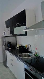 Kuchyňa alebo kuchynka v ubytovaní Apartman La maison