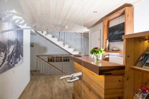 a staircase in a room with a stair case at Gästehaus Tannegg in Mittelberg