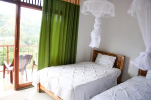 A bed or beds in a room at Elegant Home Stay