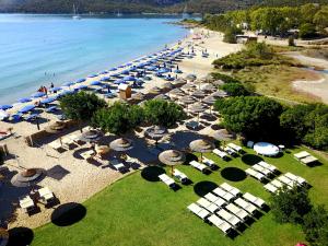 an aerial view of a beach with umbrellas and chairs at Le Ville Le Saline in Palau